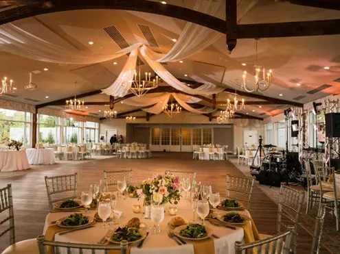 Interior of a reception venue illustrating spacious layout and natural light, enhancing the event ambiance