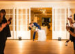 Couple exchanging vows at a wedding venue, capturing the joy of a celebration and the beautiful setting