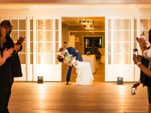 Couple exchanging vows at a wedding venue, capturing the joy of a celebration and the beautiful setting